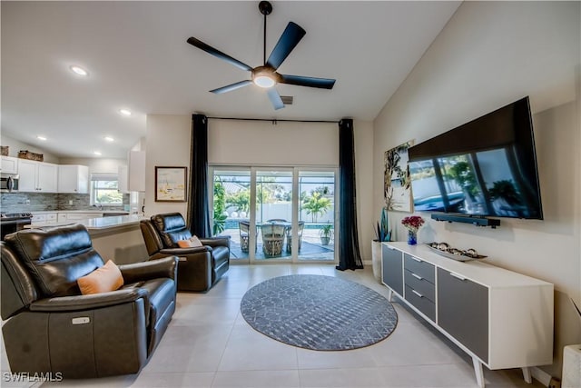 living room with ceiling fan and light tile patterned floors