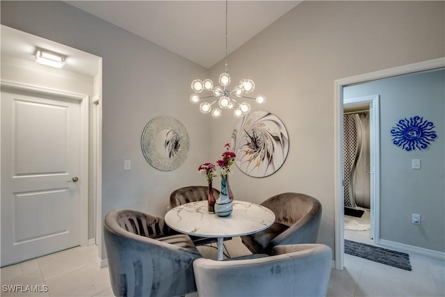 tiled dining room featuring vaulted ceiling and a chandelier