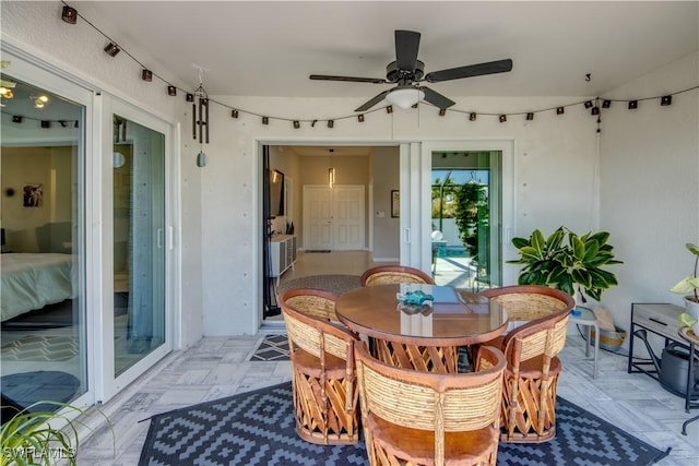 exterior space featuring ceiling fan