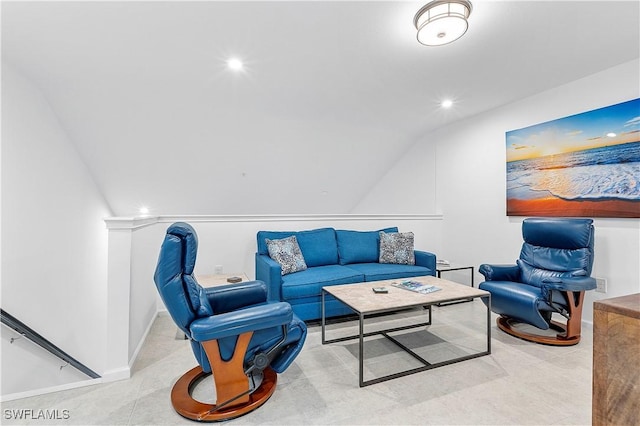 living room featuring lofted ceiling