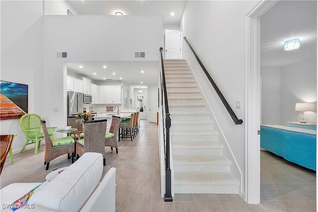 stairs featuring sink