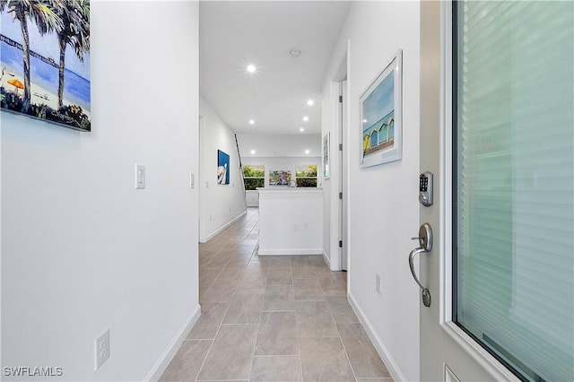 hallway featuring light tile patterned floors