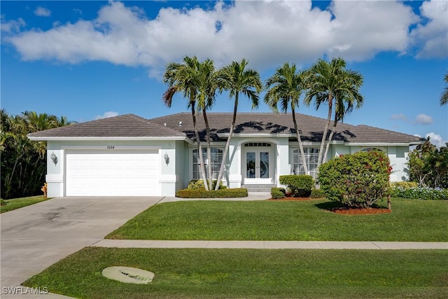1524 Kingston Ct, Marco Island, FL 34145 - ranch-style house featuring french doors, a garage, a front lawn, stucco siding, and concrete driveway