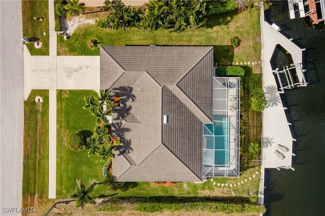 birds eye view of property with a water view