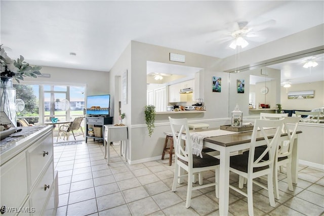 dining area featuring light tile patterned flooring and ceiling fan