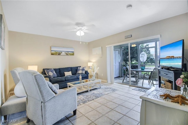 living room with ceiling fan and light tile patterned floors