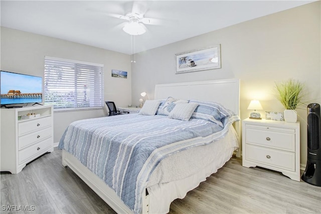 bedroom with ceiling fan and light hardwood / wood-style flooring