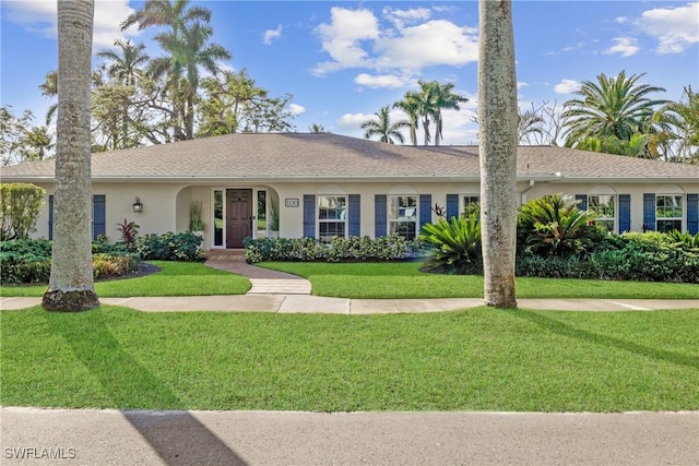 ranch-style house featuring a front lawn