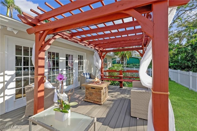 deck with a fire pit, french doors, and a pergola