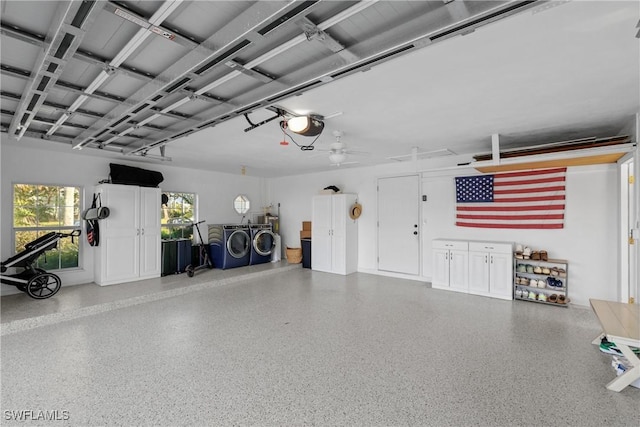 garage with ceiling fan, washer and clothes dryer, and a garage door opener