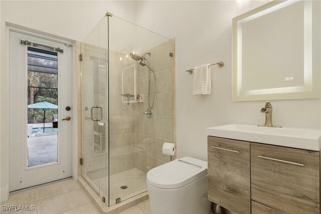 bathroom with a shower with shower door, tile patterned floors, toilet, and vanity