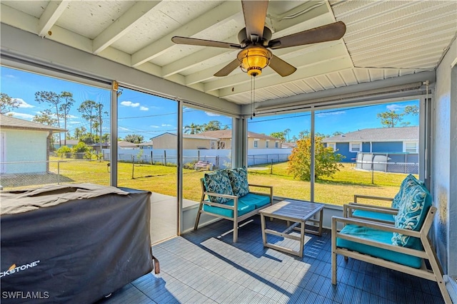 sunroom with ceiling fan