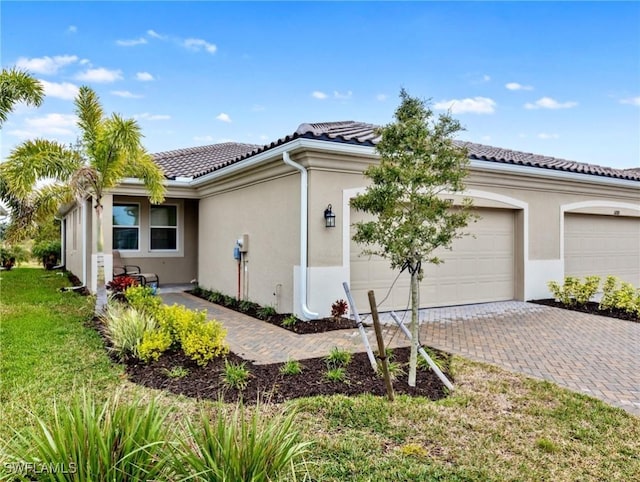 view of property exterior with a garage and a yard