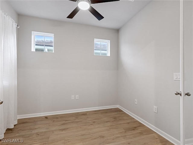 empty room featuring ceiling fan and light hardwood / wood-style floors