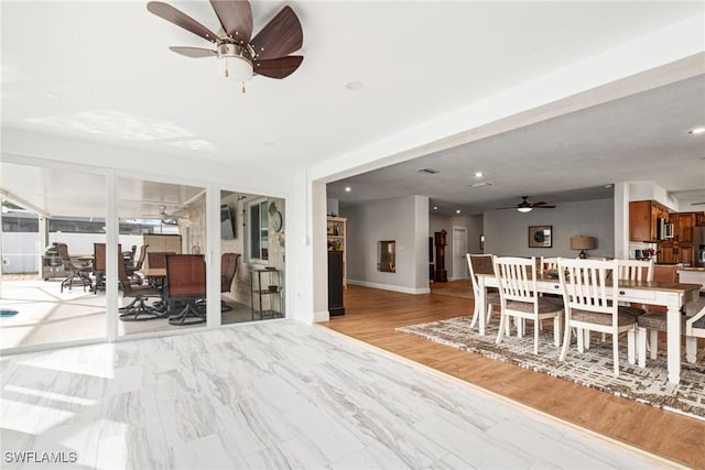 dining space with ceiling fan