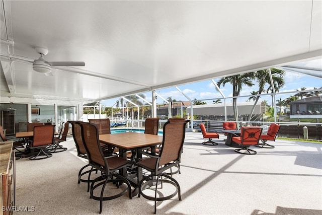 sunroom / solarium with ceiling fan