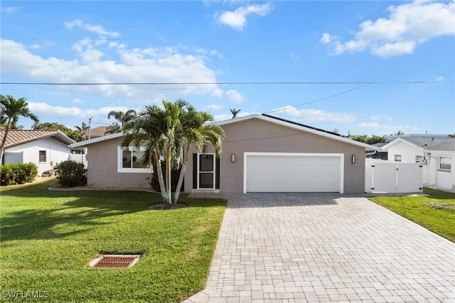 single story home with a front lawn and a garage