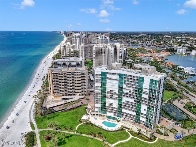 birds eye view of property with a view of the beach and a water view