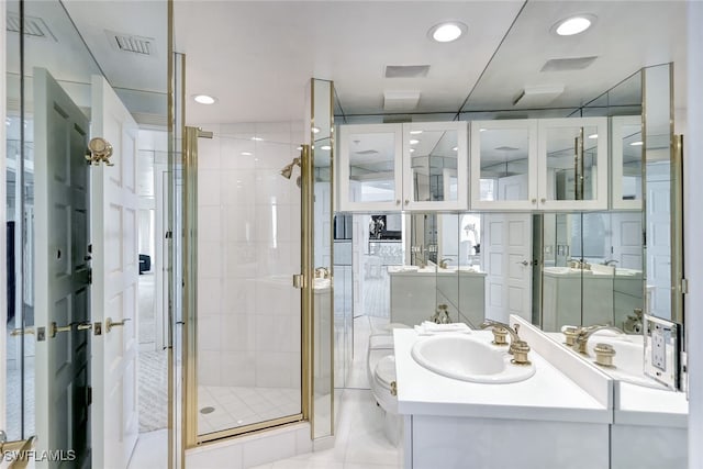 bathroom featuring tile patterned floors, walk in shower, and vanity