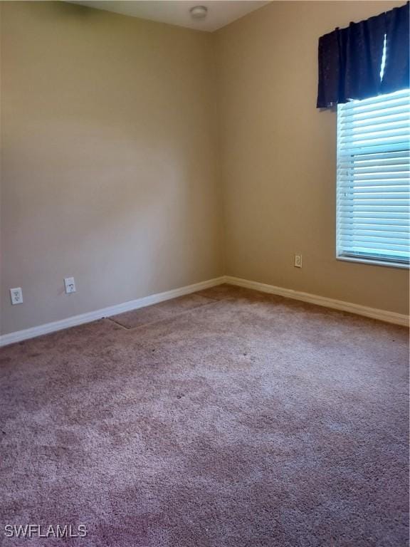 unfurnished room featuring carpet flooring