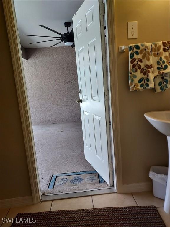 bathroom featuring tile patterned floors and ceiling fan