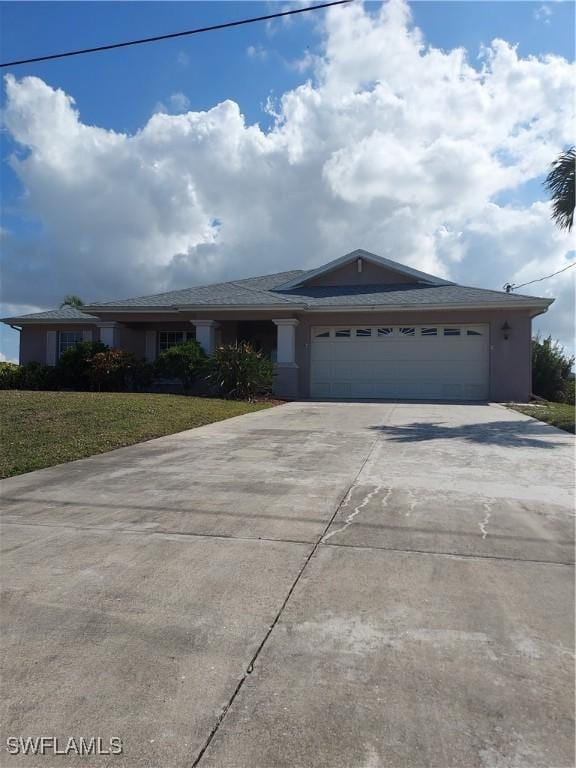 ranch-style house with a garage and a front yard