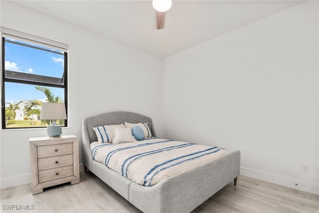 bedroom featuring ceiling fan and light hardwood / wood-style floors