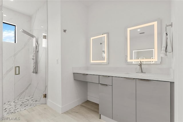 bathroom featuring vanity and walk in shower