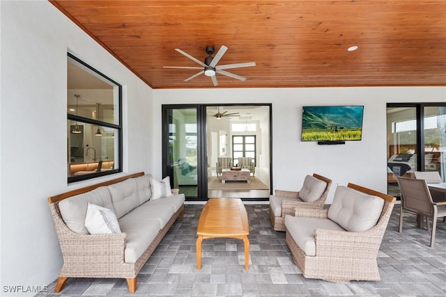 living room with ceiling fan and wood ceiling