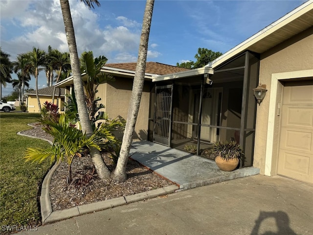 view of side of home featuring a garage