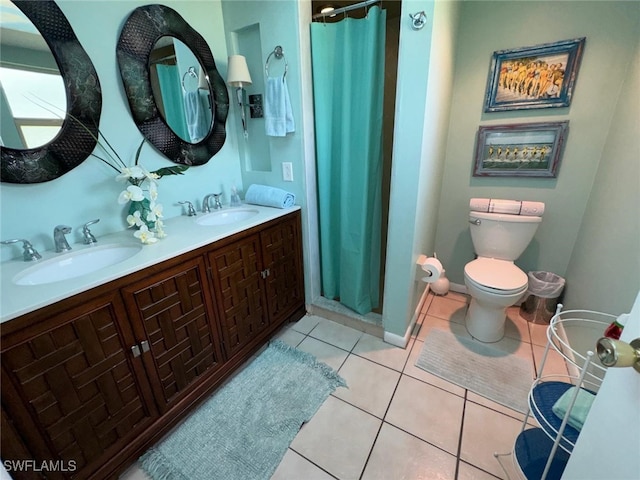 bathroom with tile patterned flooring, vanity, a shower with curtain, and toilet