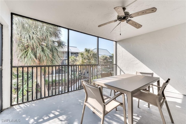 sunroom featuring ceiling fan and a wealth of natural light