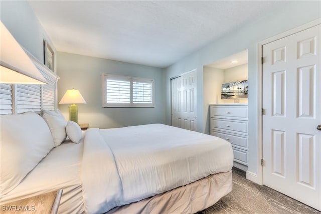 carpeted bedroom featuring a closet