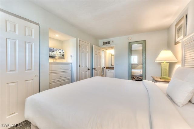 bedroom featuring ensuite bathroom