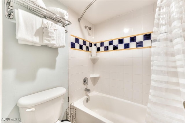 bathroom with toilet and shower / bath combo