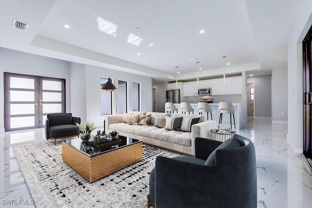 living room with a raised ceiling