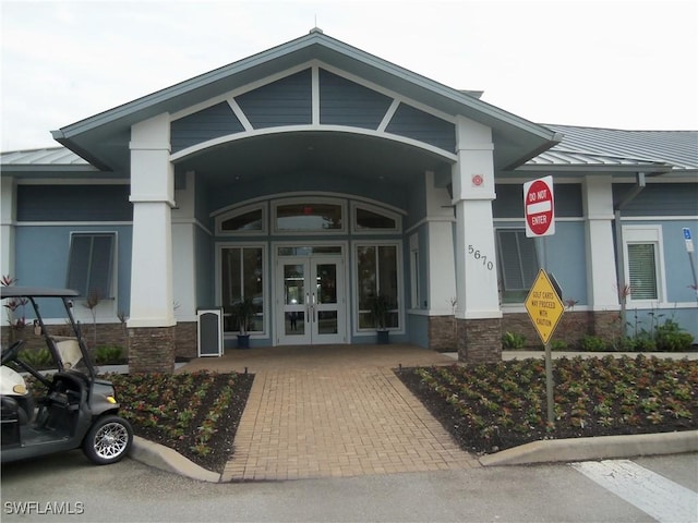 entrance to property featuring french doors