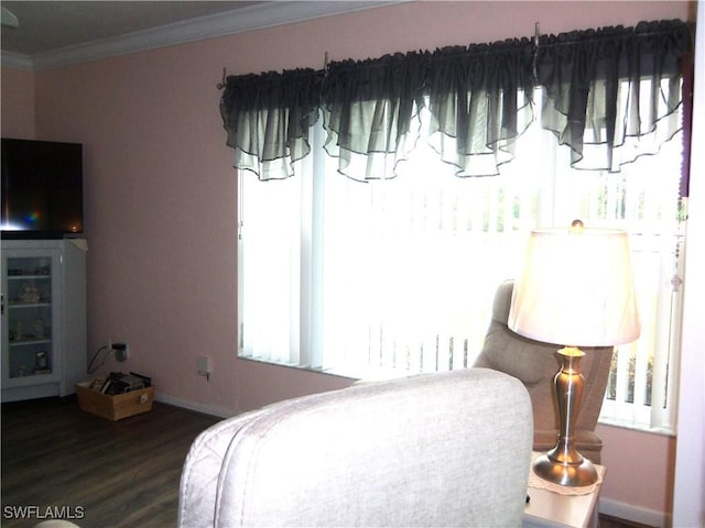 bedroom with dark hardwood / wood-style flooring and crown molding