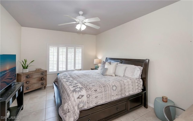 tiled bedroom featuring ceiling fan