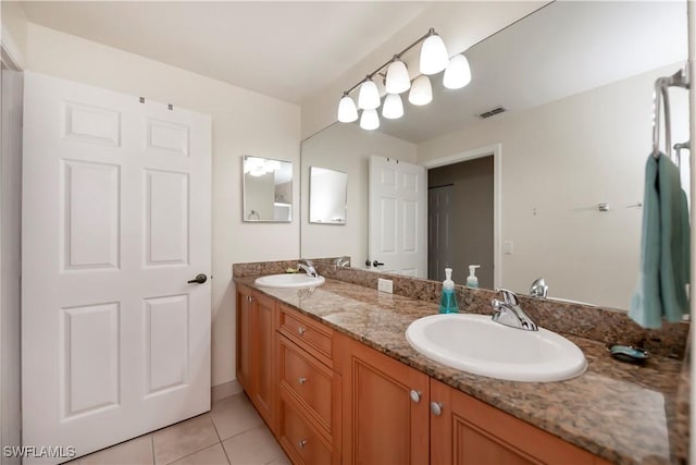 bathroom featuring vanity and tile patterned flooring