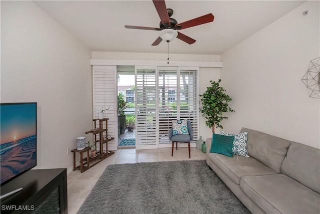 living room with ceiling fan and light tile patterned flooring