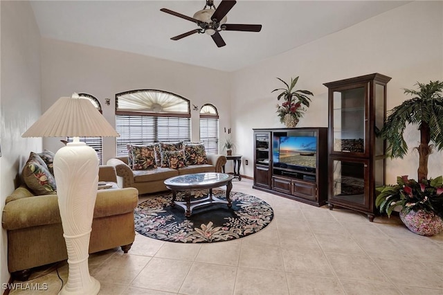 tiled living room featuring ceiling fan