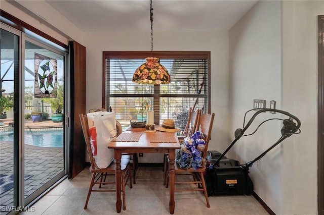 dining room featuring light tile patterned flooring