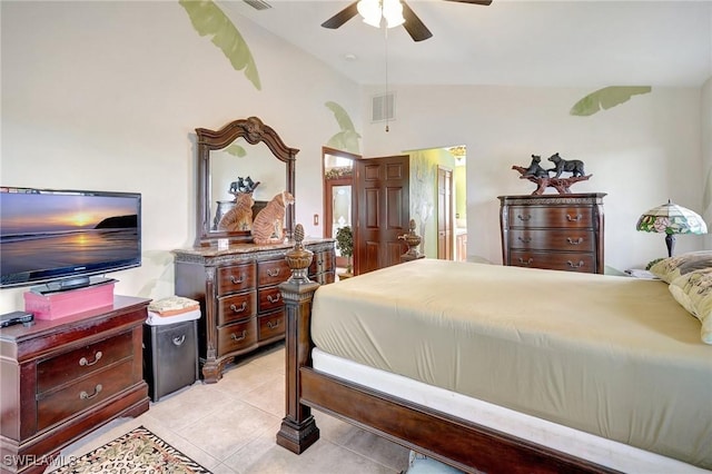 bedroom with light tile patterned floors, vaulted ceiling, and ceiling fan