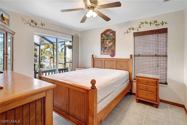 tiled bedroom featuring ceiling fan and access to outside