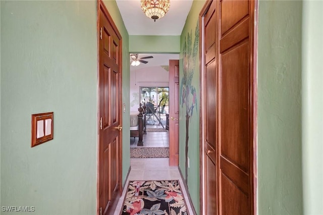 hall with light tile patterned floors