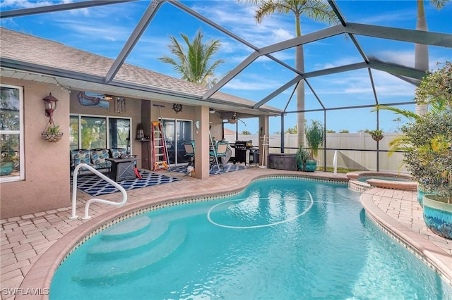 view of pool featuring an in ground hot tub, a patio, and glass enclosure