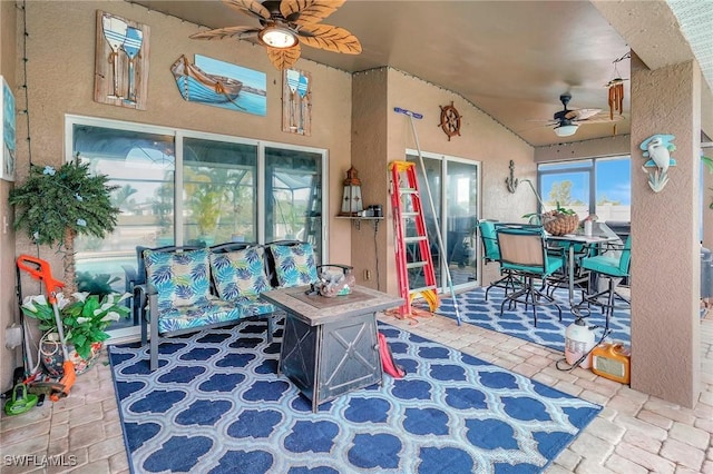 game room with lofted ceiling and ceiling fan