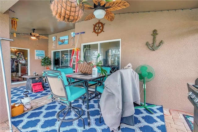 view of patio / terrace featuring ceiling fan