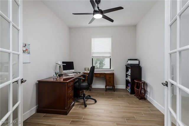 office area with ceiling fan and french doors